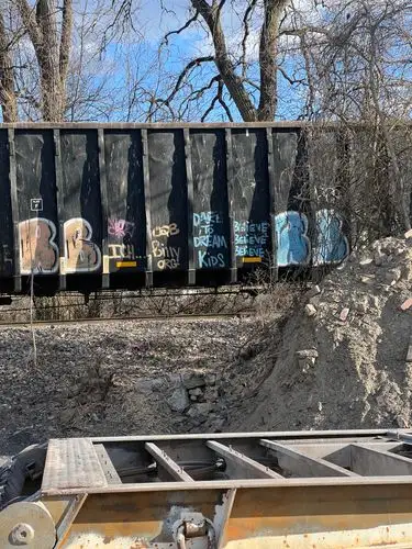 Gritty urban art on a passing train.